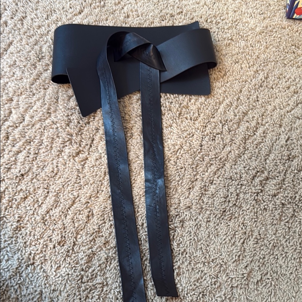 Black vinyl wide asymmetric belt
